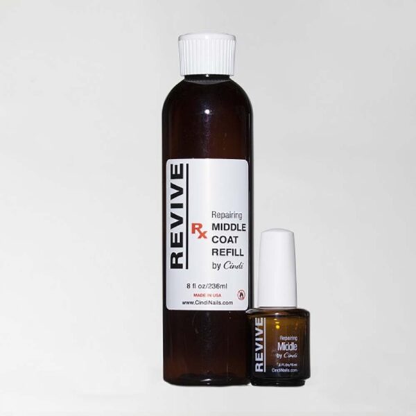 A Bottle Of "Revive" Nail Repair Middle Coat Refill By Cindi With A Small Bottle As Well.