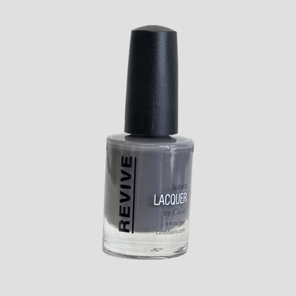 A Bottle Of "Revive" Natural Nail Lacquer In A Grey Shade, With A Black Cap, By Cindi Nails.
