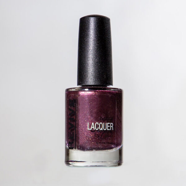 Close-up Of A Bottle Of "Revive" Brand Nail Lacquer, Featuring A Dark Purple Color With A Shimmering Effect.