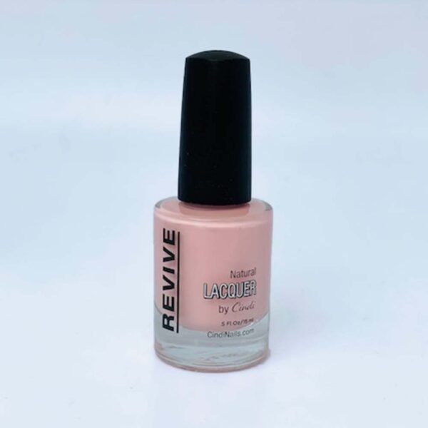 A Bottle Of Revive Natural Lacquer Nail Polish In A Pale Pink Shade, With A Black Cap, Set Against A Light Background.
