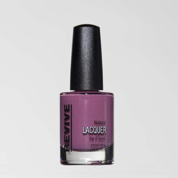 A Close-up Of A Bottle Of Revive Natural Lacquer Nail Polish In A Mauve Color, With The Brand Name On The Side.