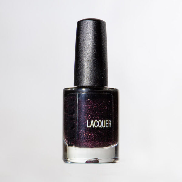 A Bottle Of Dark Purple Glitter Nail Lacquer With A Black Cap, Isolated On A White Background. "Lacquer" Label.