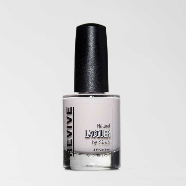 Nail Lacquer Bottle By Cindi Nails, Featuring A Pale Pink Shade, With A Black Cap, Against A White Background. The Bottle Says "Revive".