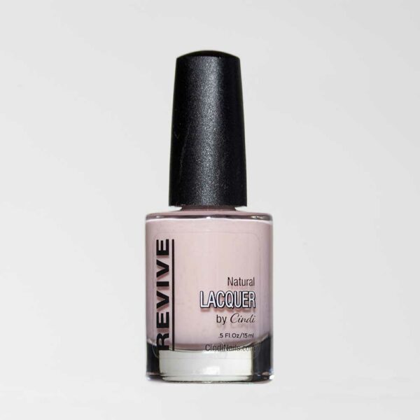 A Bottle Of Revive Natural Lacquer Nail Polish In A Pale Pink Or Beige Shade.