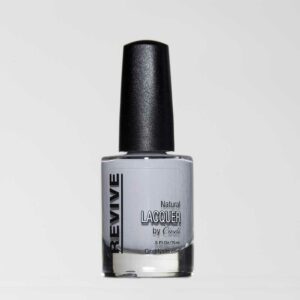 A Bottle Of "Revive Natural Lacquer" Nail Polish In A Light Gray Color, With A Black Cap, Against A White Background.