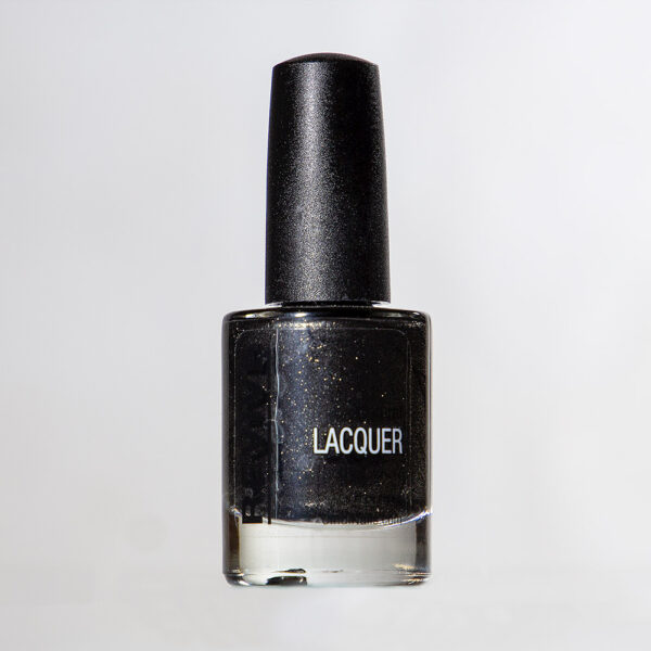 Close-up Shot Of A Black Nail Polish Bottle With "Lacquer" Label, Against A White Background.