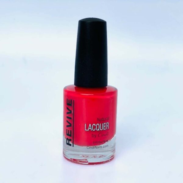 A Bottle Of Red Nail Polish With A Black Cap, Labeled "Revive Natural Lacquer By Cindi."